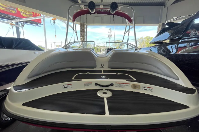 Slide: The Image of 2008 Yamaha Boats AR210 rear view showcasing swim platform and seating area. - 10