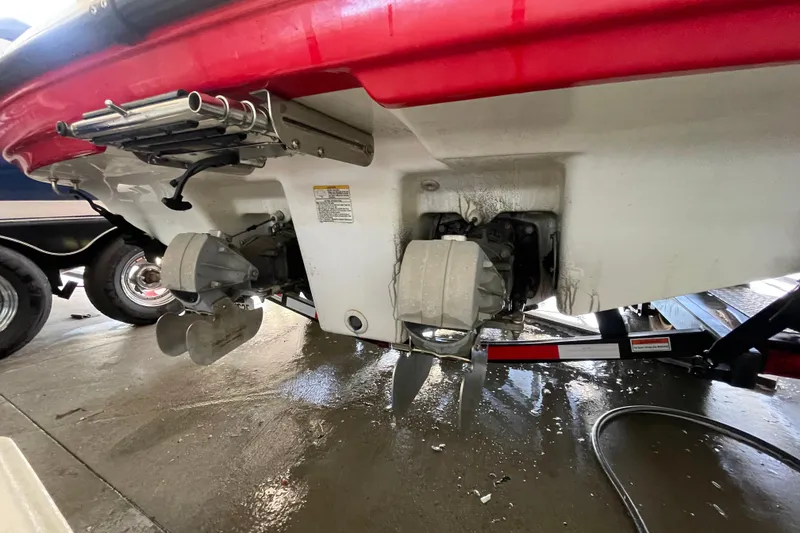 Slide: The Image of Rear view of a 2008 Yamaha Boats AR210 showing dual propellers and trailer. - 12