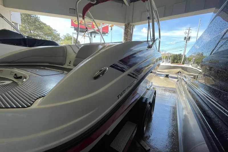 Slide: The Image of 2008 Yamaha Boats AR210 on trailer, showcasing sleek design and twin engine feature. - 13