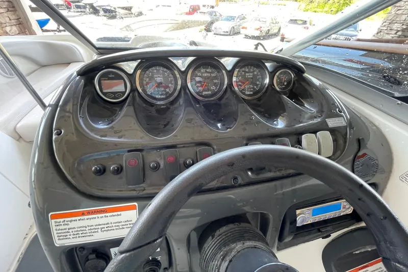Slide: The Image of Dashboard of a 2008 Yamaha Boats AR210, featuring gauges and controls. - 6