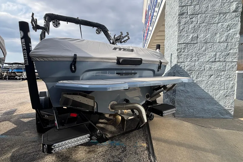 Slide: The Image of 2026 MB B52 23 Classic boat on trailer outside Big Thunder Marine center. - 1