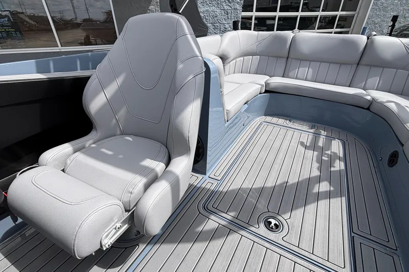 Slide: The Image of 2026 MB B52 23 Classic boat interior with gray seating and sleek flooring. - 12