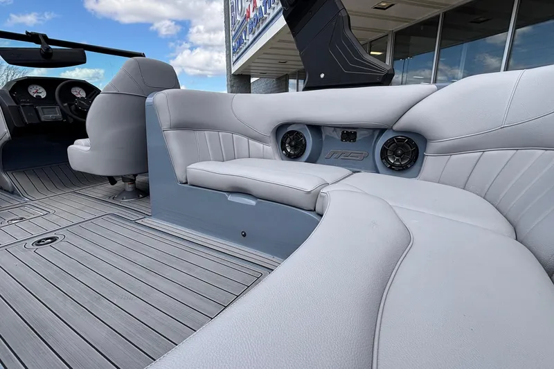 Slide: The Image of Interior of 2026 MB B52 23 Classic boat with gray seating and dashboard. - 19