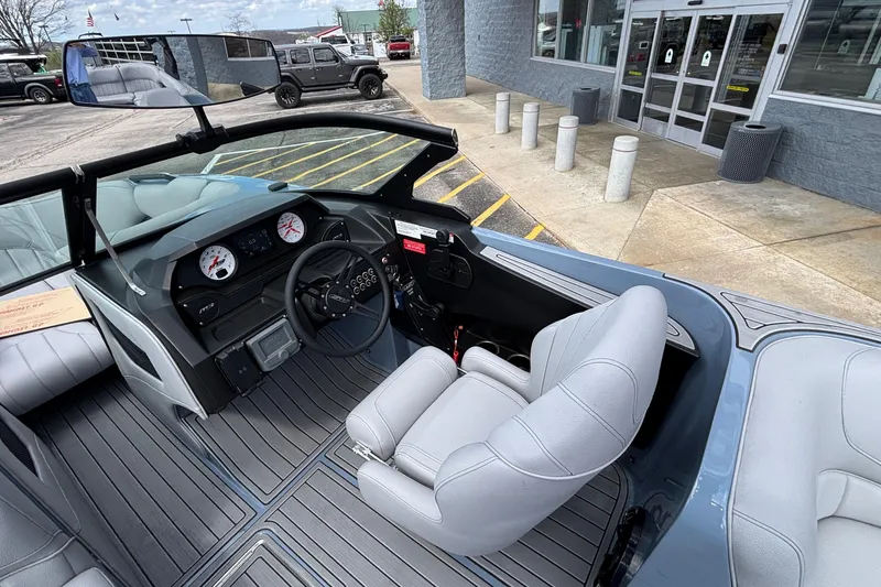 Slide: The Image of Interior of 2026 MB B52 23 Classic boat with modern dashboard and seating. - 20