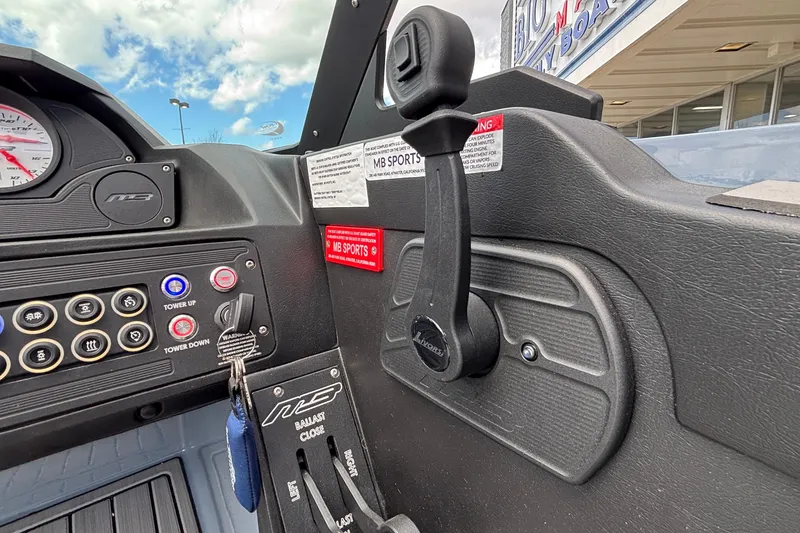 Slide: The Image of Control panel of 2026 MB B52 23 Classic boat with throttle and switches. - 23