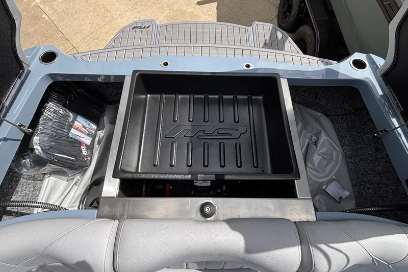 Slide: The Image of Rear view of 2026 MB B52 23 Classic boat with storage compartment open. - 27