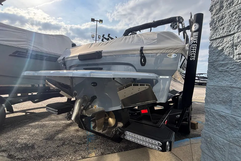 Slide: The Image of 2026 MB B52 23 Classic boat on trailer under cloudy sky. - 3