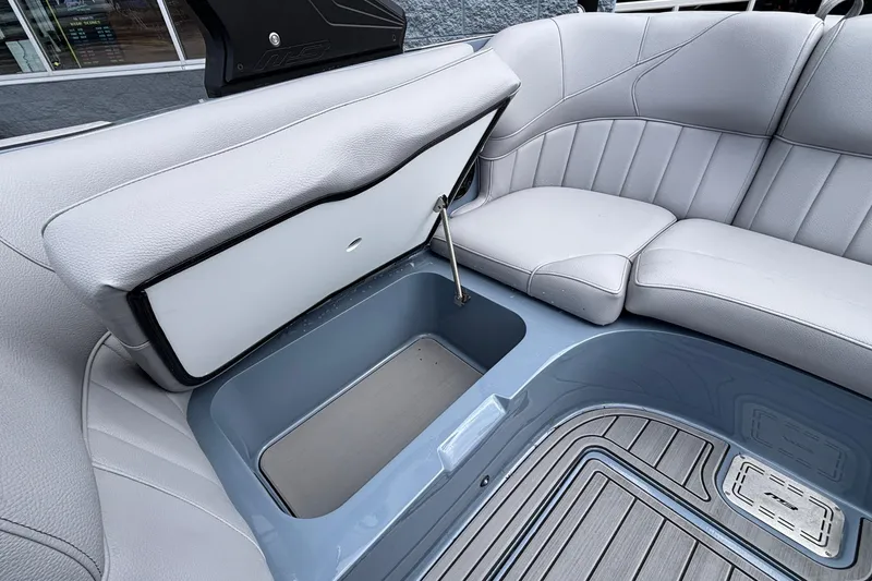 Slide: The Image of 2026 MB B52 23 Classic boat interior with open storage compartment and cushioned seating. - 33