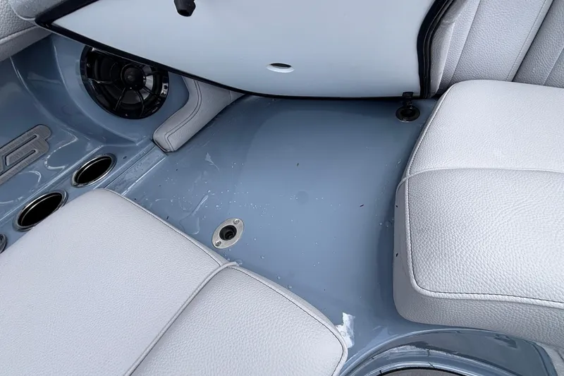 Slide: The Image of Interior of 2026 MB B52 23 Classic boat with gray seating and speaker. - 34