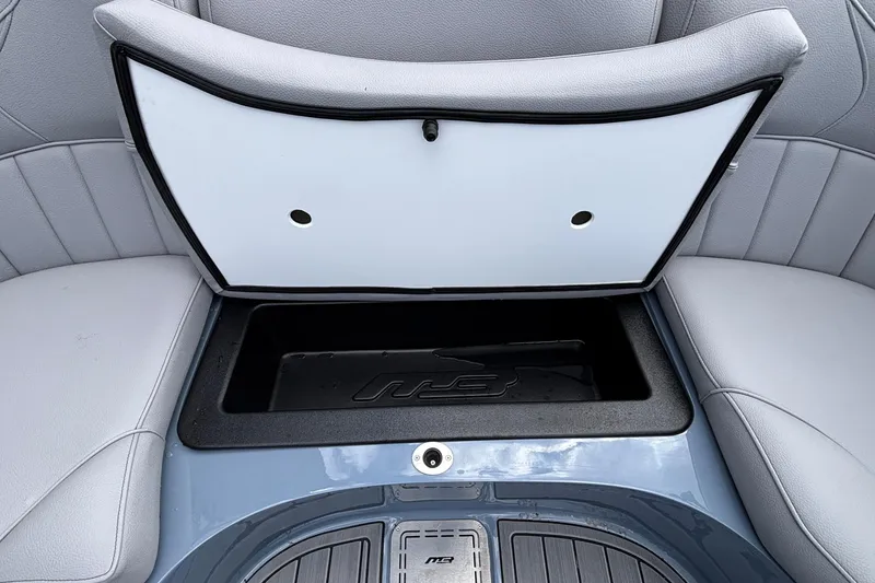 Slide: The Image of Open storage compartment in 2026 MB B52 23 Classic boat with gray seating. - 35