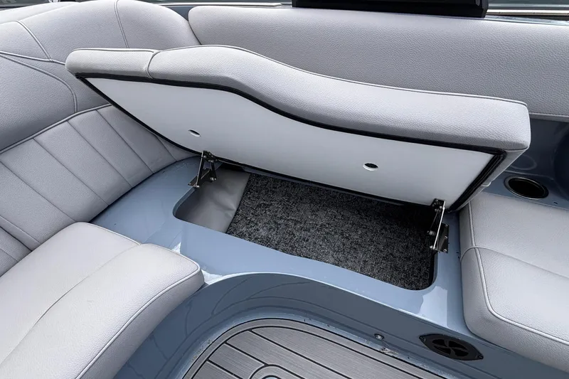 Slide: The Image of 2026 MB B52 23 Classic boat interior with open storage compartment and gray seating. - 36