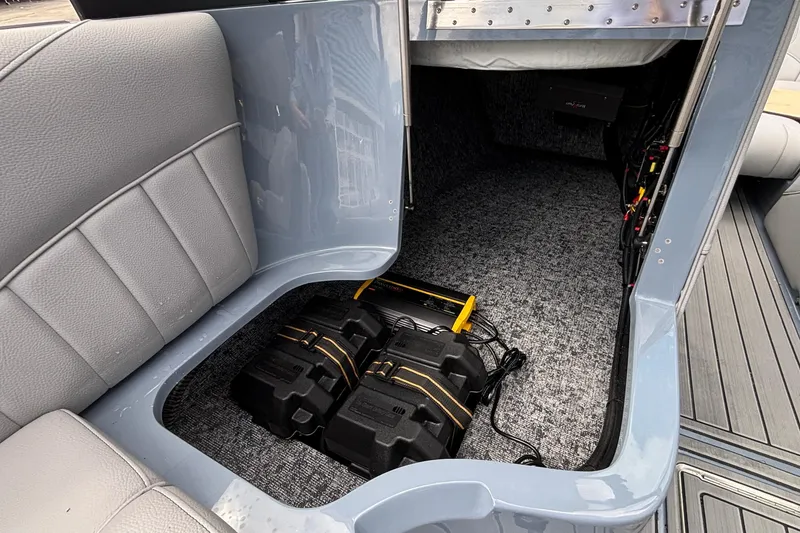 Slide: The Image of Interior of 2026 MB B52 23 Classic boat showing storage and battery compartment. - 38