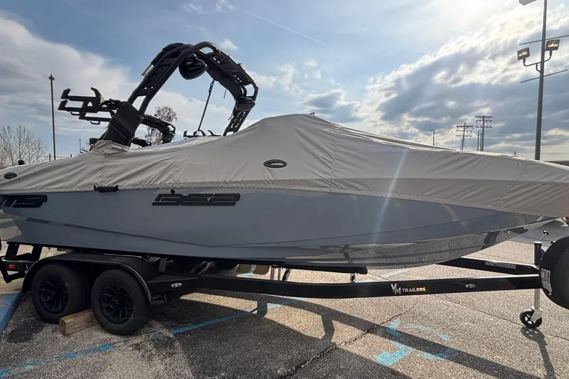 Slide: The Image of 2026 MB B52 23 Classic boat covered, parked at Thunder Marine Boating Center. - 4