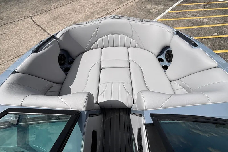 Slide: The Image of 2026 MB B52 23 Classic boat interior with luxurious gray seating and cup holders. - 44