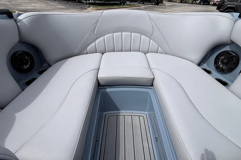 Slide: The Image of Interior of 2026 MB B52 23 Classic boat with gray seating and speakers. - 48