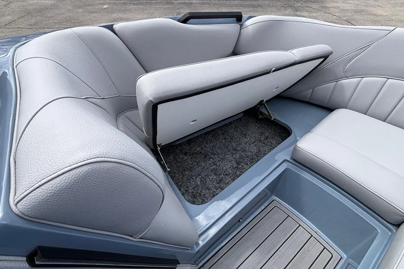 Slide: The Image of 2026 MB B52 23 Classic boat interior with open storage compartment and gray seating. - 50