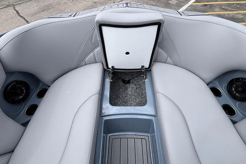 Slide: The Image of Interior of 2026 MB B52 23 Classic boat with open storage compartment. - 52