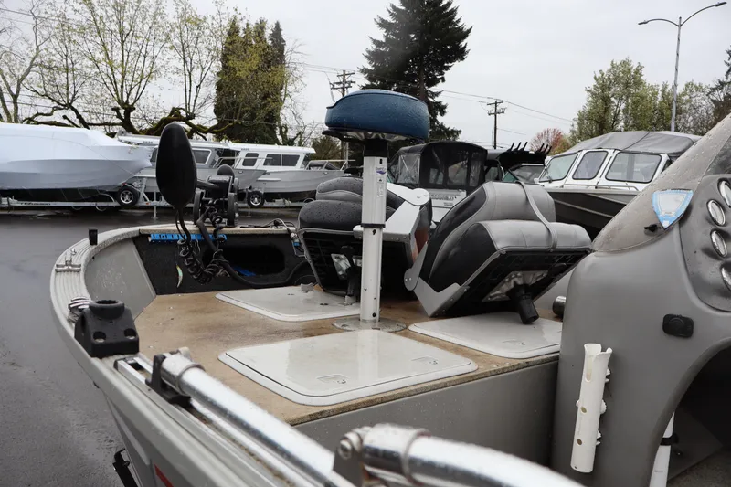 Slide: The Image of 2009 Lowe Fishing Machine 165 boat interior with seats and control panel. - 10
