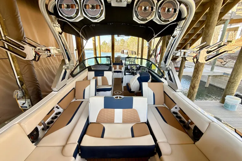 Slide: The Image of Luxurious 2022 MasterCraft X24 boat interior with premium seating and advanced audio system. - 10