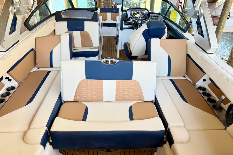 Slide: The Image of 2022 MasterCraft X24 boat interior with luxurious seating and modern design. - 11