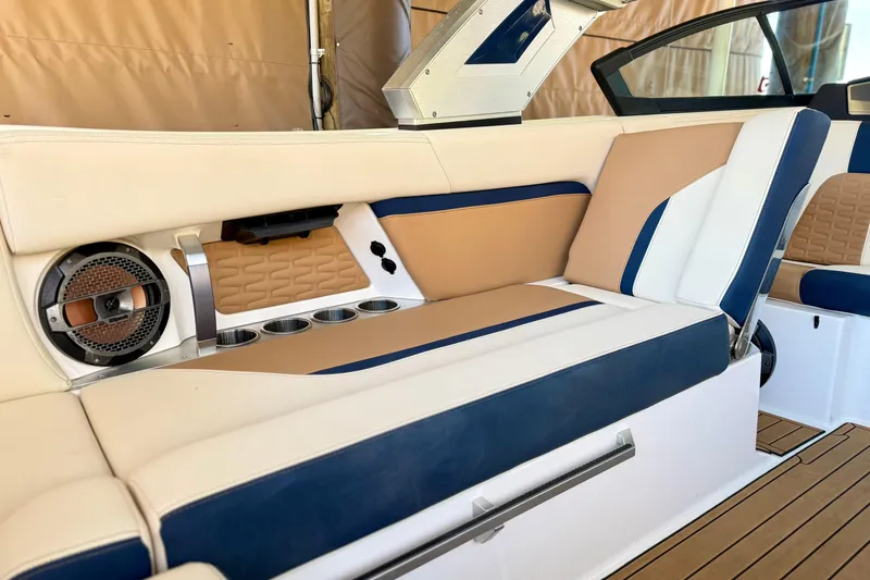 Slide: The Image of Luxurious interior of 2022 MasterCraft X24 boat with beige and blue seating. - 14