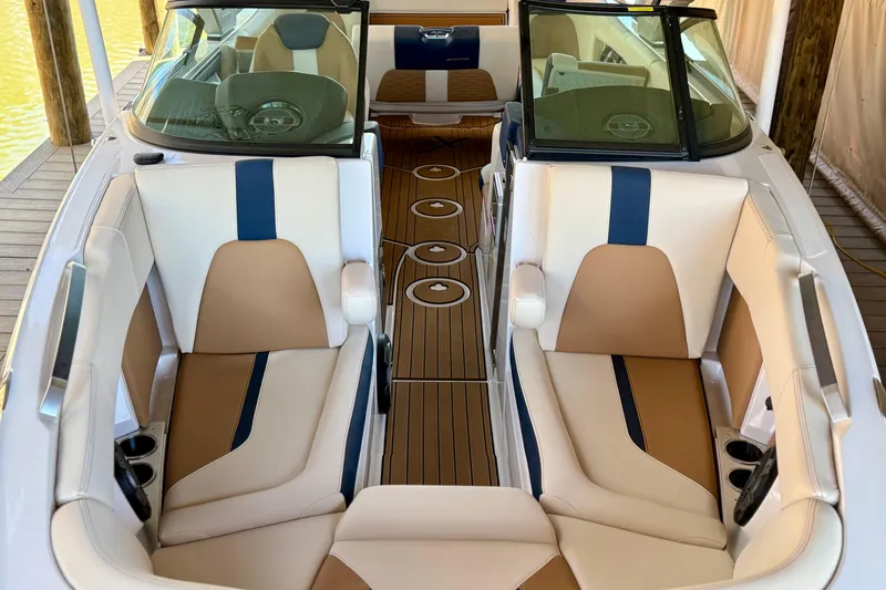 Slide: The Image of 2022 MasterCraft X24 boat interior with luxurious seating and sleek design. - 26
