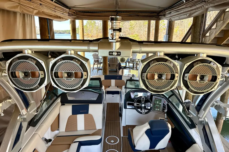 Slide: The Image of Interior of 2022 MasterCraft X24 boat with premium audio system and luxurious seating. - 31