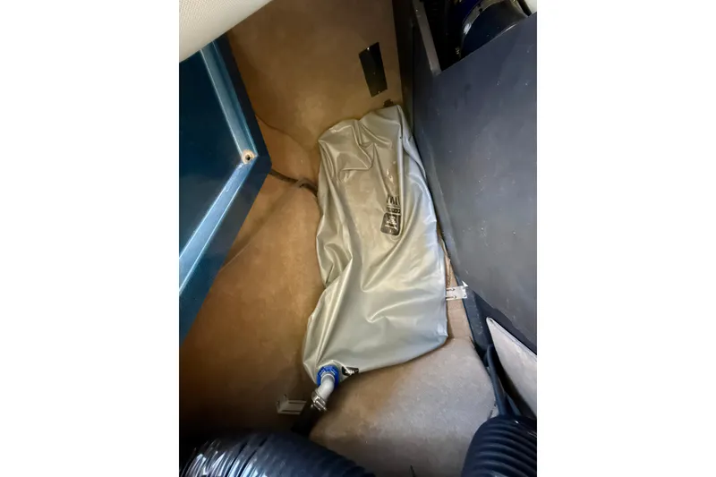 Slide: The Image of Interior view of a 2022 MasterCraft X24 boat, showing a ballast bag setup. - 34