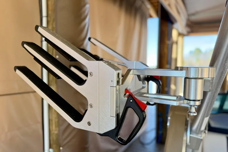 Slide: The Image of Close-up of a 2022 MasterCraft X24 wakeboard rack with sleek metal design. - 35