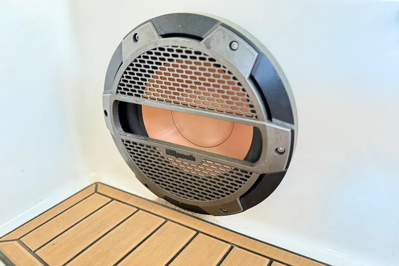 Slide: The Image of Klipsch speaker on 2022 MasterCraft X24 boat, featuring sleek design and wooden flooring. - 37