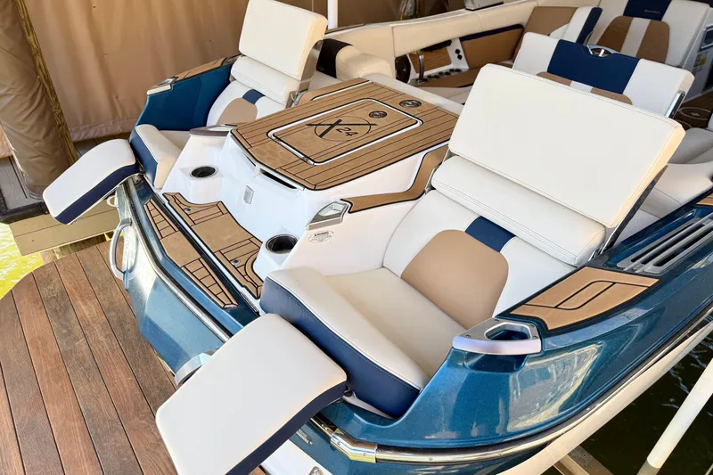 Slide: The Image of 2022 MasterCraft X24 boat interior with luxurious seating and teak accents. - 39