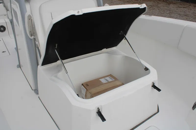 Slide: The Image of Open storage compartment on 2026 Sea Fox 268 Commander boat with a package inside. - 12
