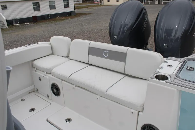 Slide: The Image of 2026 Sea Fox 268 Commander boat interior with cushioned seating and dual Yamaha outboard engines. - 18