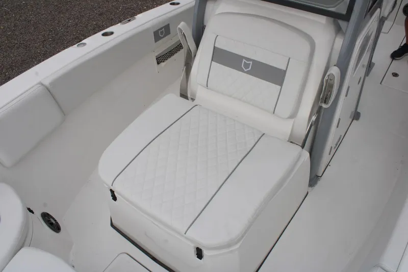 Slide: The Image of 2026 Sea Fox 268 Commander boat interior with white cushioned seating and sleek design. - 19
