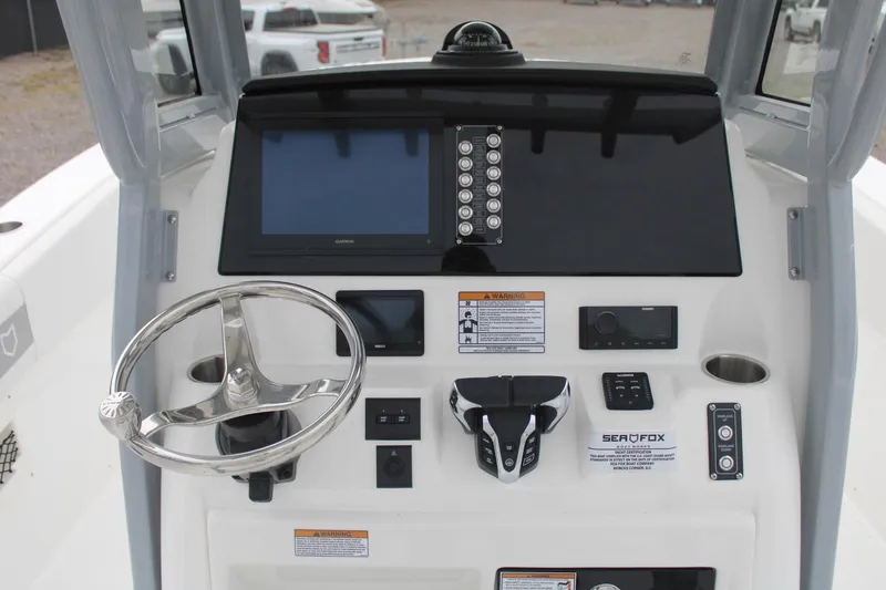 Slide: The Image of 2026 Sea Fox 268 Commander dashboard with steering wheel and electronic controls. - 7