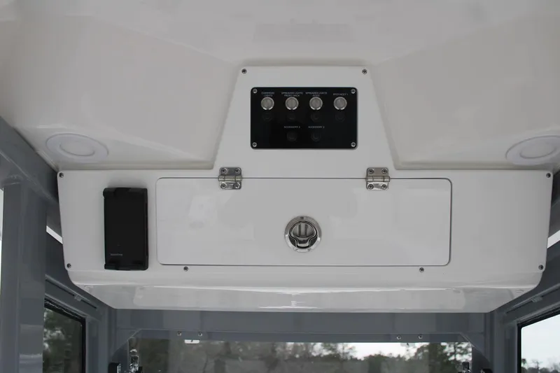 Slide: The Image of 2026 Sea Fox 268 Commander console with control panel and storage compartment. - 9