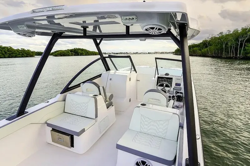 Slide: The Image of Manufacturer Provided Image: 2026 Twin Vee 280 GFX2 DC boat interior on calm water, featuring modern seating and controls. - 4