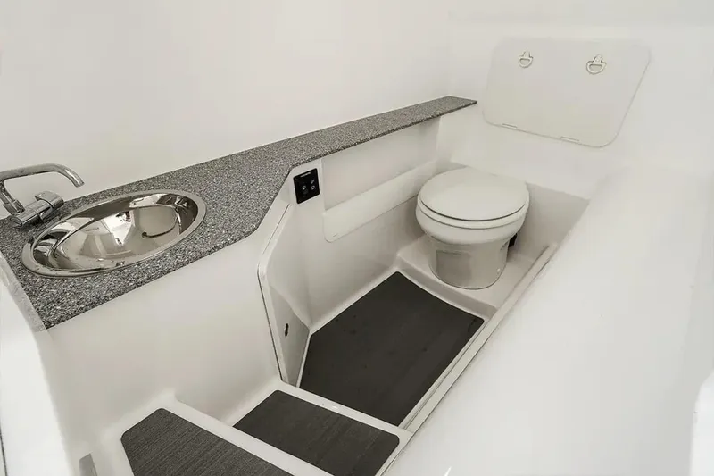Slide: The Image of Interior of 2026 Twin Vee 280 GFX2 DC with sink and toilet. - 5