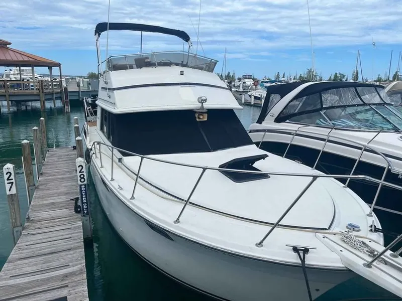 The Image of 1983 Carver 3207 Aft Cabin docked at marina. - 0