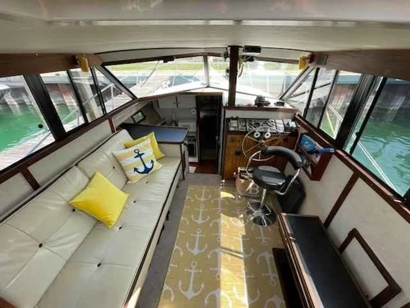 Slide: The Image of Interior of a 1983 Carver 3207 Aft Cabin yacht with nautical decor. - 4