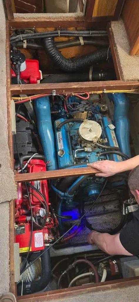 Slide: The Image of Engine compartment of a 1983 Carver 3207 Aft Cabin with blue engine cover. - 8