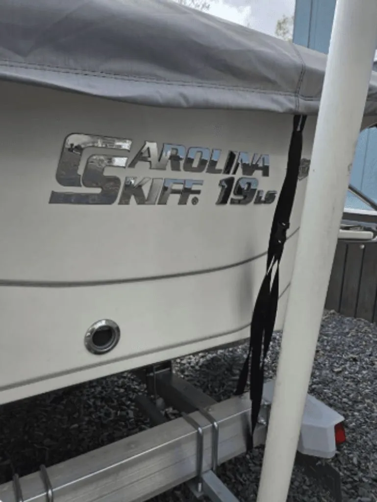 Slide: The Image of 2020 Carolina Skiff 19 LS boat with cover on trailer. - 10