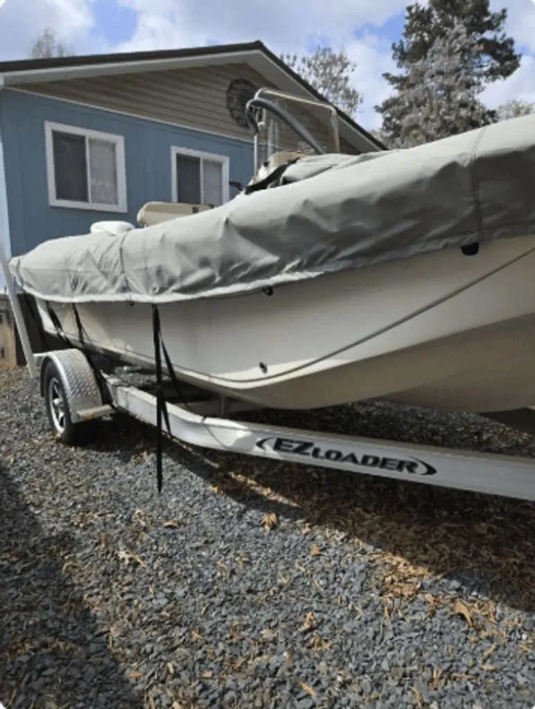 Slide: The Image of 2020 Carolina Skiff 19 LS boat on trailer in front of house. - 12