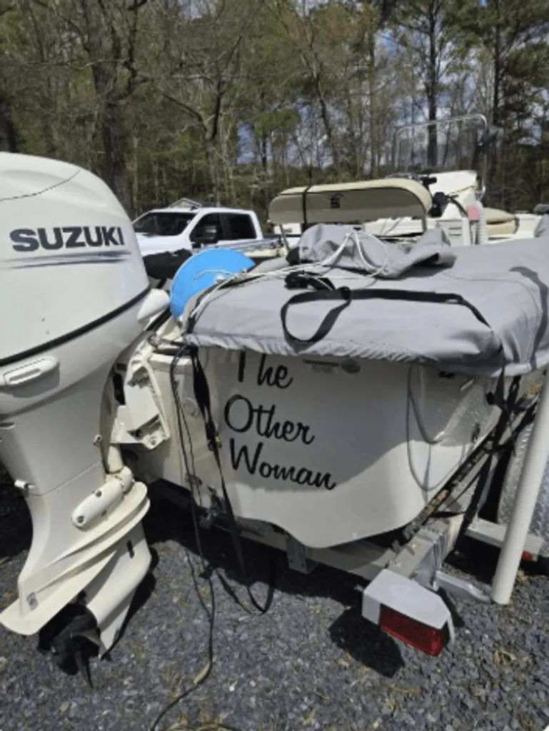 Slide: The Image of 2020 Carolina Skiff 19 LS boat with Suzuki motor outdoors. - 13