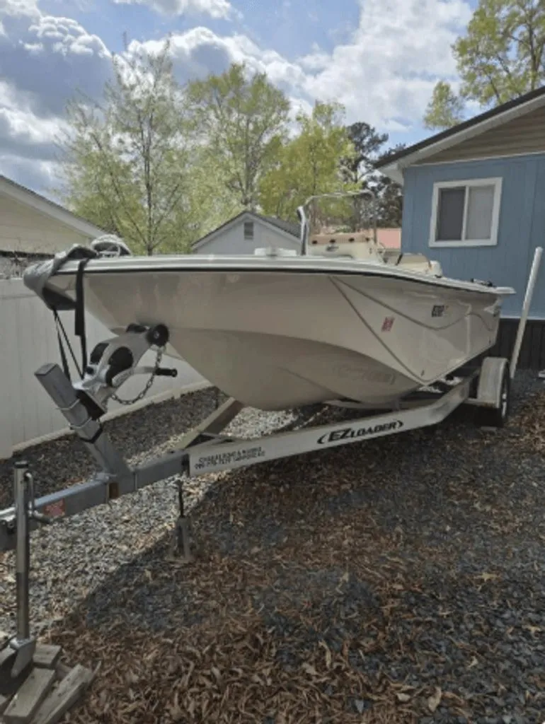 Slide: The Image of 2020 Carolina Skiff 19 LS boat on trailer outdoors. - 14