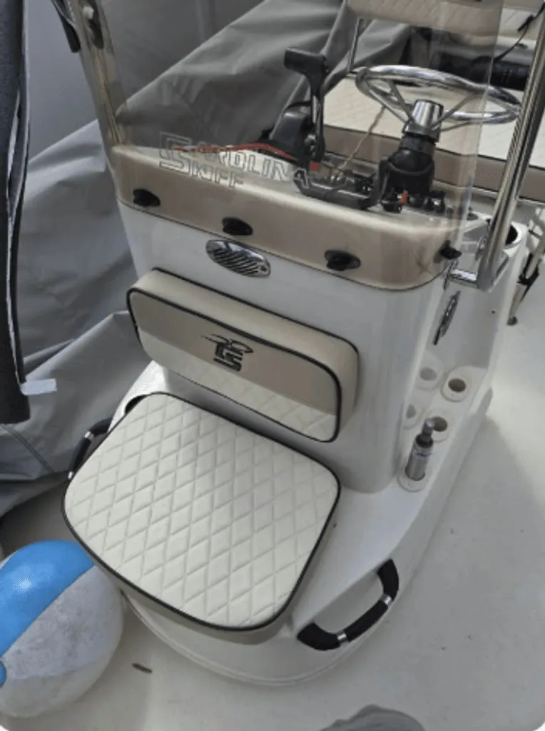 Slide: The Image of Interior view of a 2020 Carolina Skiff 19 LS boat with steering console. - 4