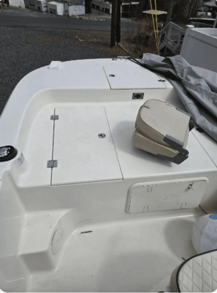 Slide: The Image of 2020 Carolina Skiff 19 LS boat deck with storage compartments. - 7