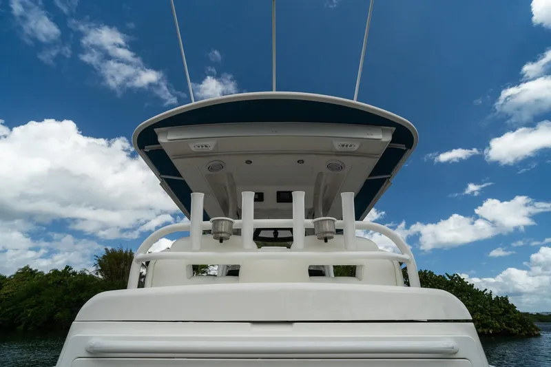 Slide: The Image of 2020 Regulator 31 boat against a blue sky with clouds. - 22