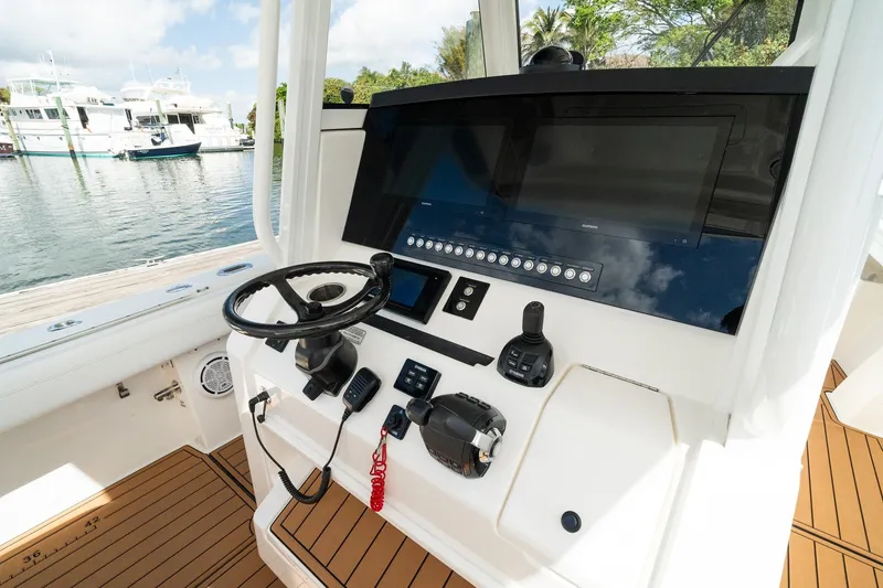 Slide: The Image of Helm of 2020 Regulator 31 boat with modern controls and navigation system. - 42