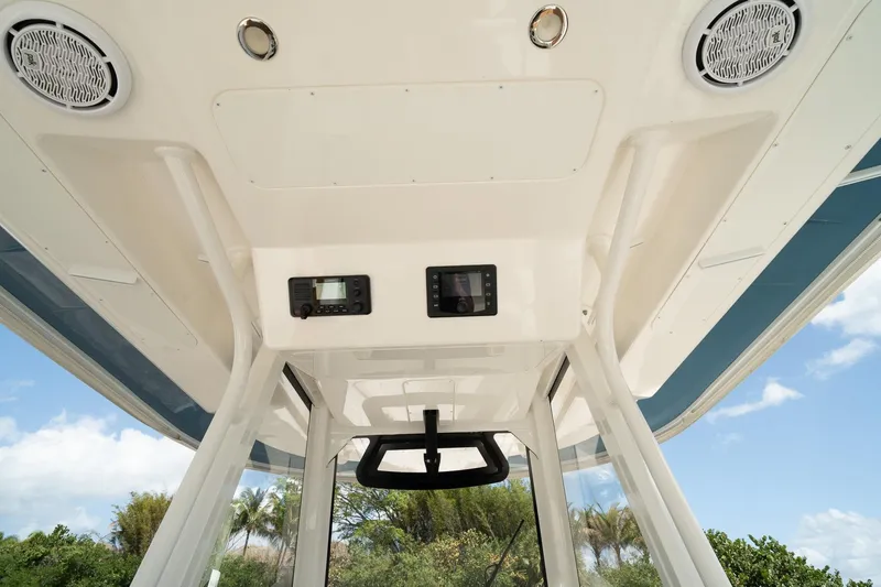 Slide: The Image of 2020 Regulator 31 boat interior ceiling with speakers and control panels. - 43